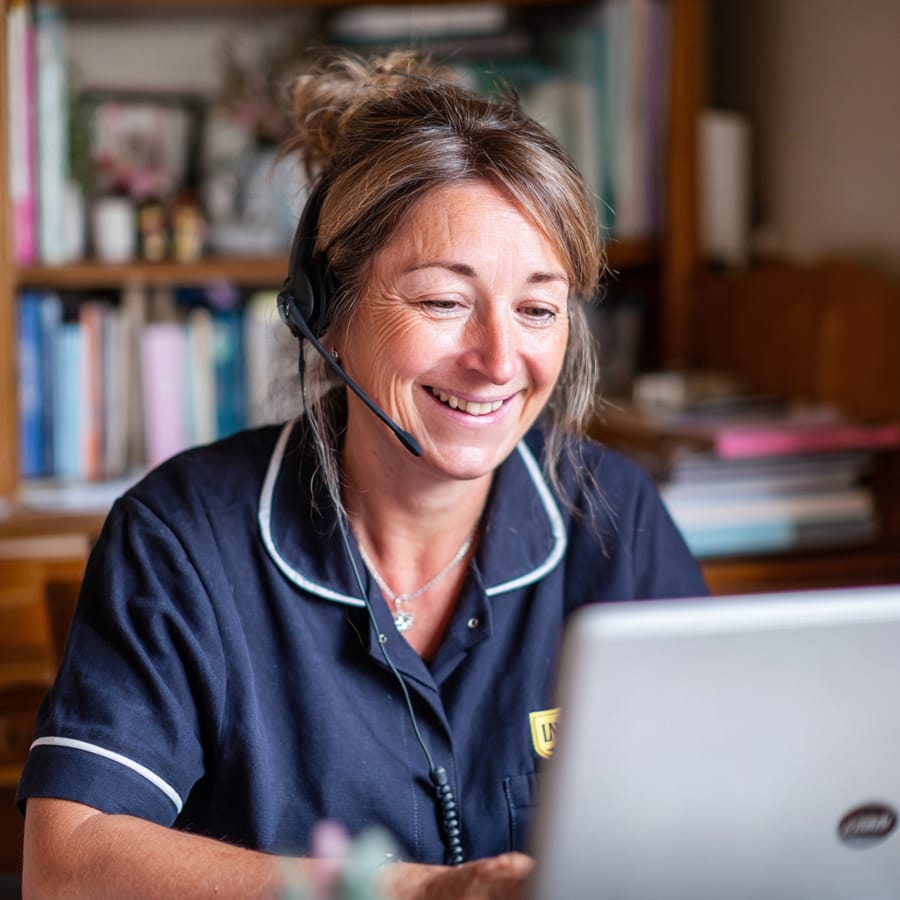 A WellChosen care coordinator on the phone with a family